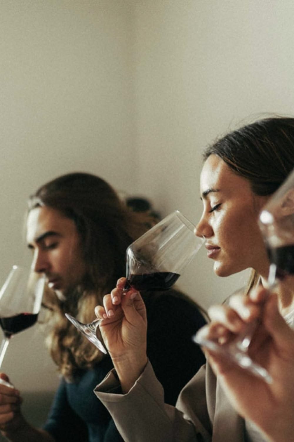 Two guests nosing wine glasses during a guided tasting