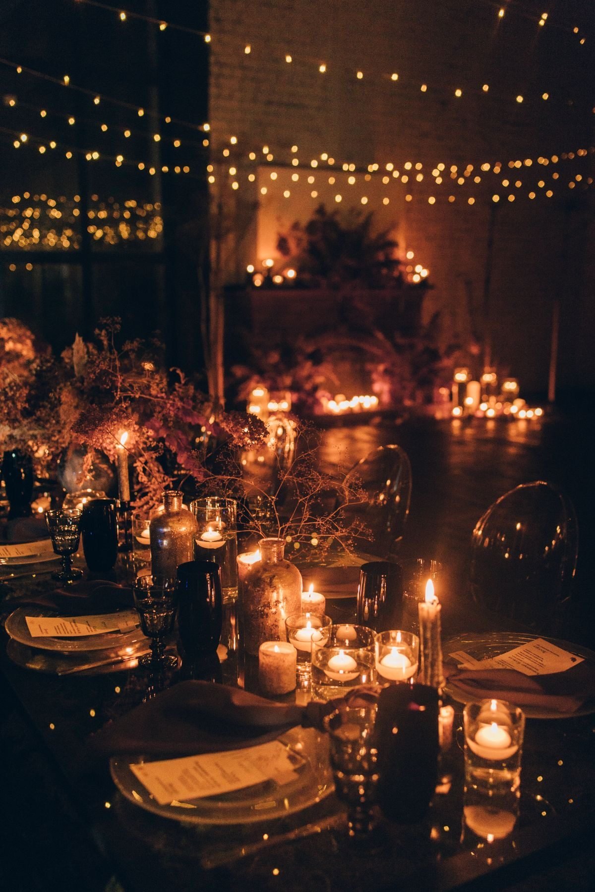 An evening dinner beneath strings of lights
